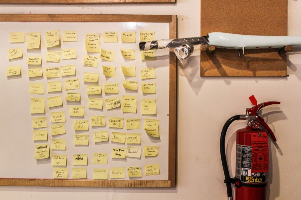 Each frame is tracked through completion on this whiteboard.