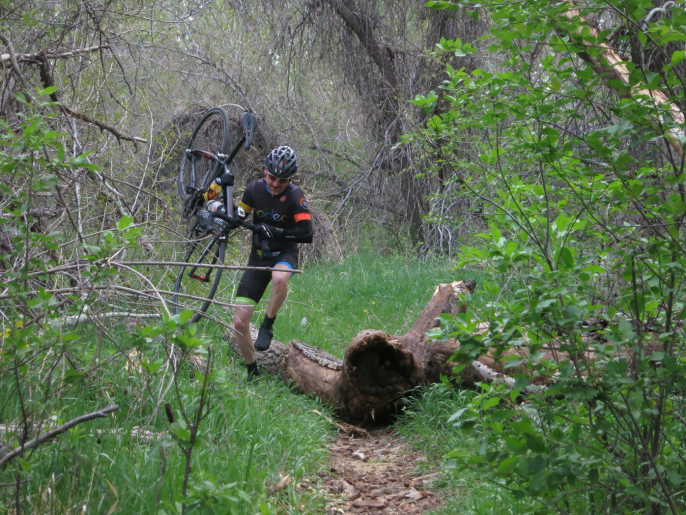 Patrick hopping natural barriers during their recon ride (a la 1970s cyclocross). Photo credit - Matt Deviney