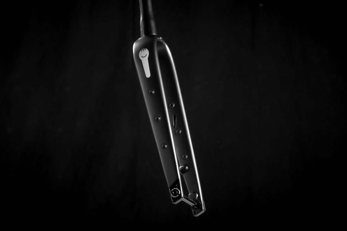 Rodeo Labs Spork Series 3 carbon adventure fork with integrated routing through the steer tube and three mid-leg eyelets. This gravel bike fork has increased load carrying capacity for mounting gear during bikepacking.