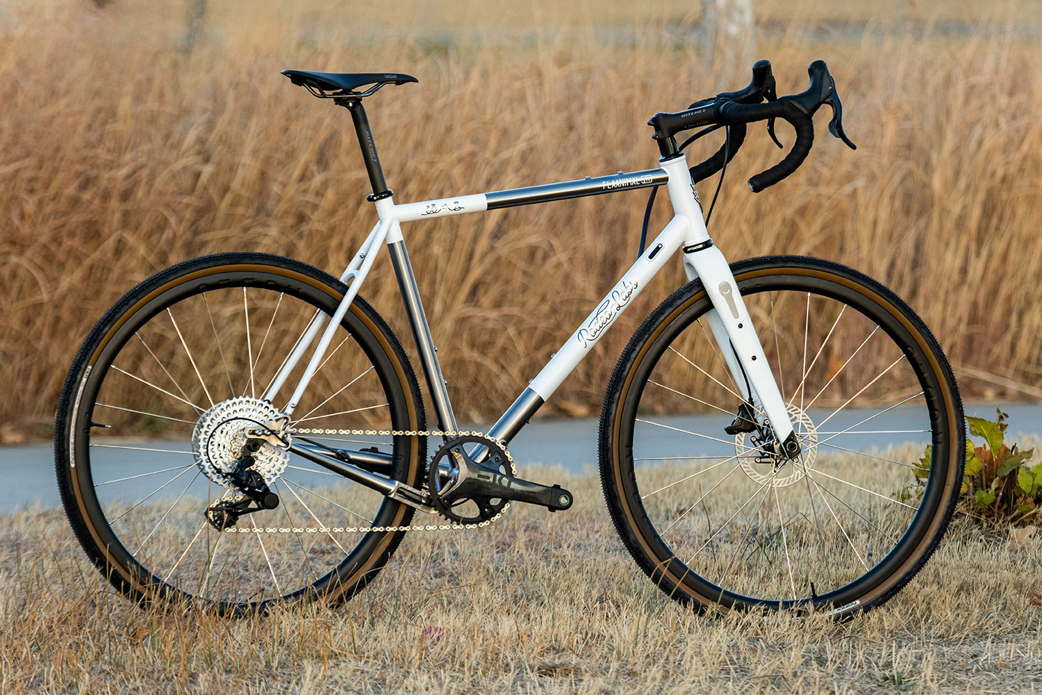 White custom cerakote Rodeo Labs Flaanimal raw brushed titanium gravel bike.
