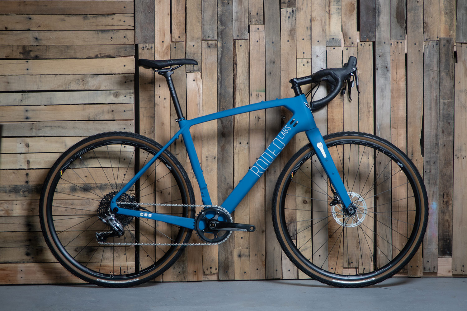 Blue custom cerakote painted Rodeo Labs Traildonkey carbon gravel and road bike.