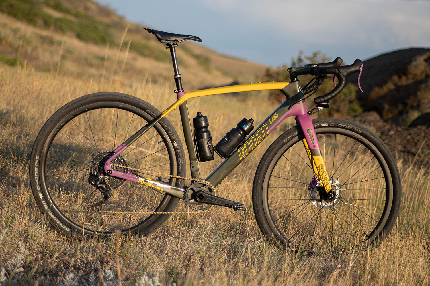Black, yellow, and purple custom cerakote painted Rodeo Labs Traildonkey carbon gravel bike with dropper post.