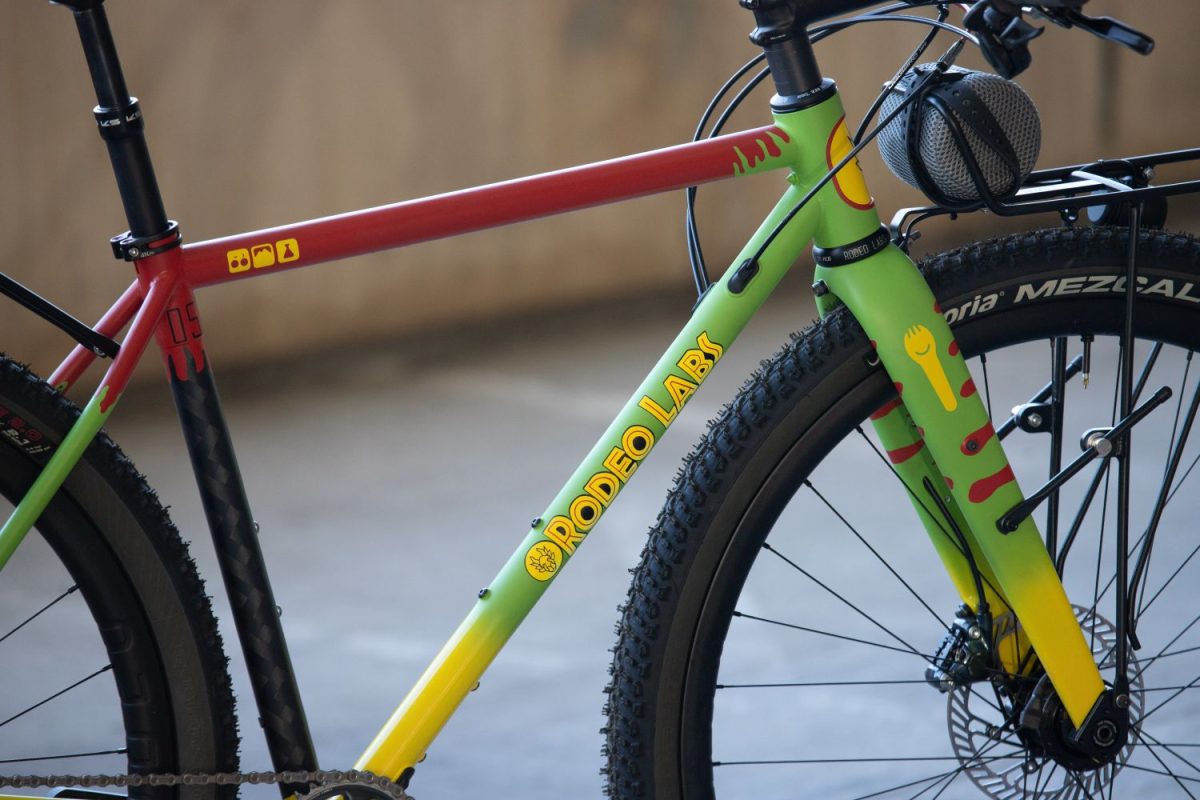 Jurassic Park logo parody for Rodeo Labs Flaanimal. This gravel bike has a custom paint job themed to look like the Ford Explorer from Jurassic Park in green, red, and yellow.