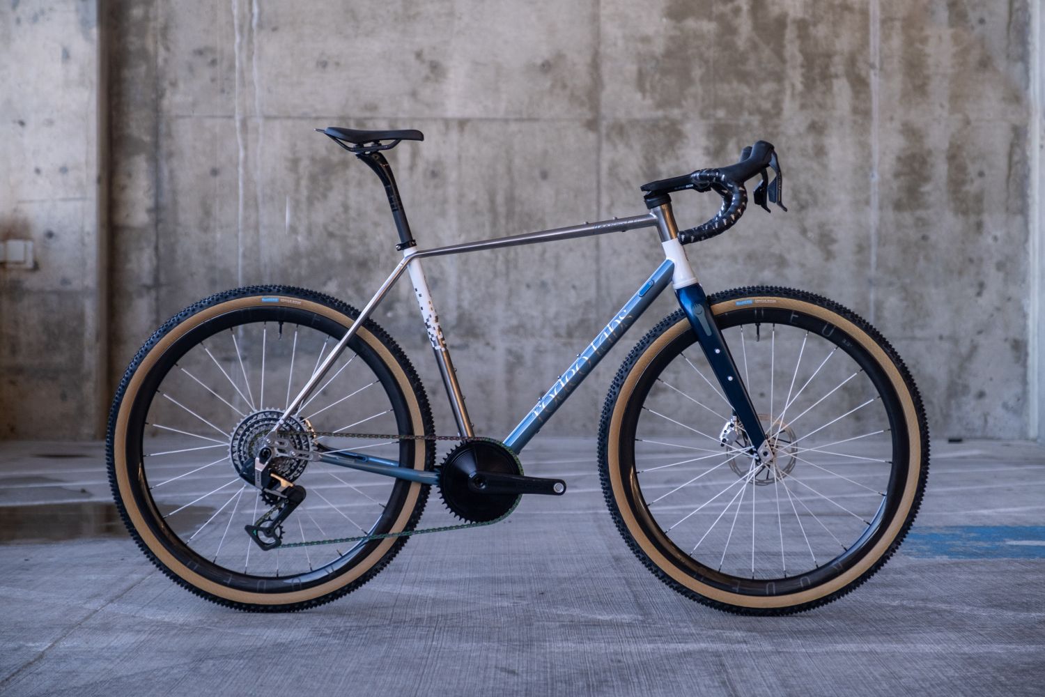 Rodeo Labs Flaanimal 6 Titanium gravel bike with custom cerakote blue FX paint job along with a white digital fade that goes down the seat tube.