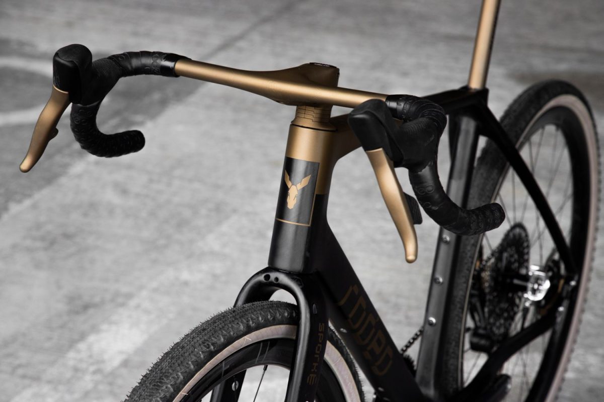 Carbon and bronze Rodeo Labs Traildonkey TD4.2 gravel bike with a view showing the headtube and color matched handlebars and shift levers.